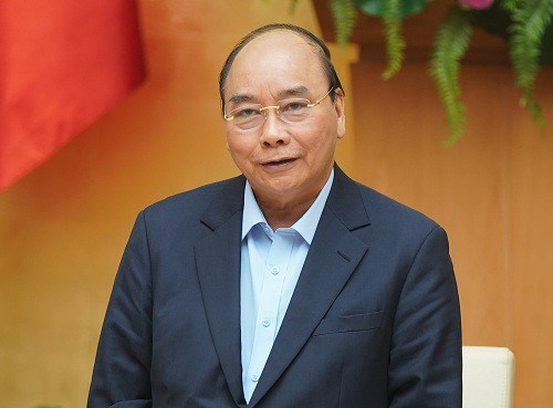 Thủ tướng Nguyễn Xuân Phúc:Từ 16.3, thực hiện nghiêm việc đeo khẩu trang nơi công cộng - Anh 1