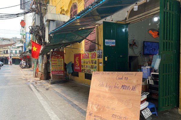 Hà Nội: Nhiều cửa hàng vẫn kinh doanh sau yêu cầu đóng cửa - Anh 15