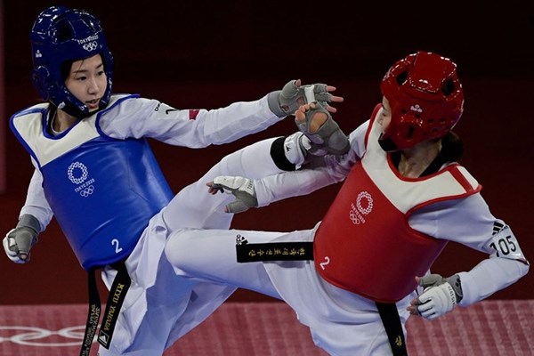 Olympic Tokyo: Kim Tuyền thua ngược võ sĩ từng vô địch thế giới - Anh 1