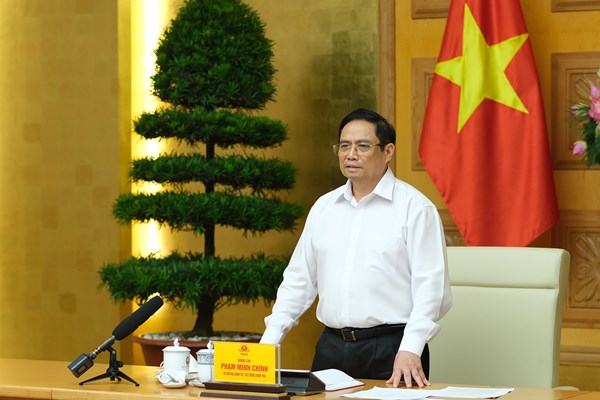 Thủ tướng Phạm Minh Chính làm việc với các đơn vị về chuyển giao công nghệ, nghiên cứu, sản xuất vắcxin Covid-19 - Anh 1