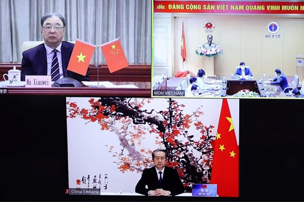 Việt Nam và Trung Quốc hội đàm trực tuyến về phòng chống dịch Covid-19 - Anh 1