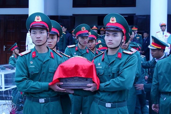 Truy điệu và an táng hài cốt liệt sĩ quân tình nguyện Việt Nam hy sinh tại Lào - Anh 3