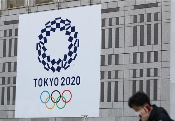Không bắt buộc VĐV tham dự Olympic Tokyo phải tiêm vaccine Covid-19 - Anh 1