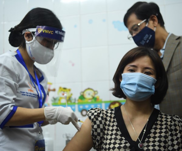 Việt Nam bắt đầu tiêm chủng vaccine phòng, ngừa Covid-19 - Anh 8