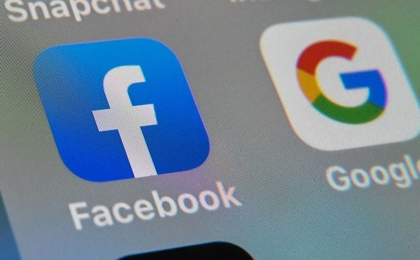 Dự luật mới giúp các nhà xuất bản tin tức đàm phán với Facebook - Anh 1